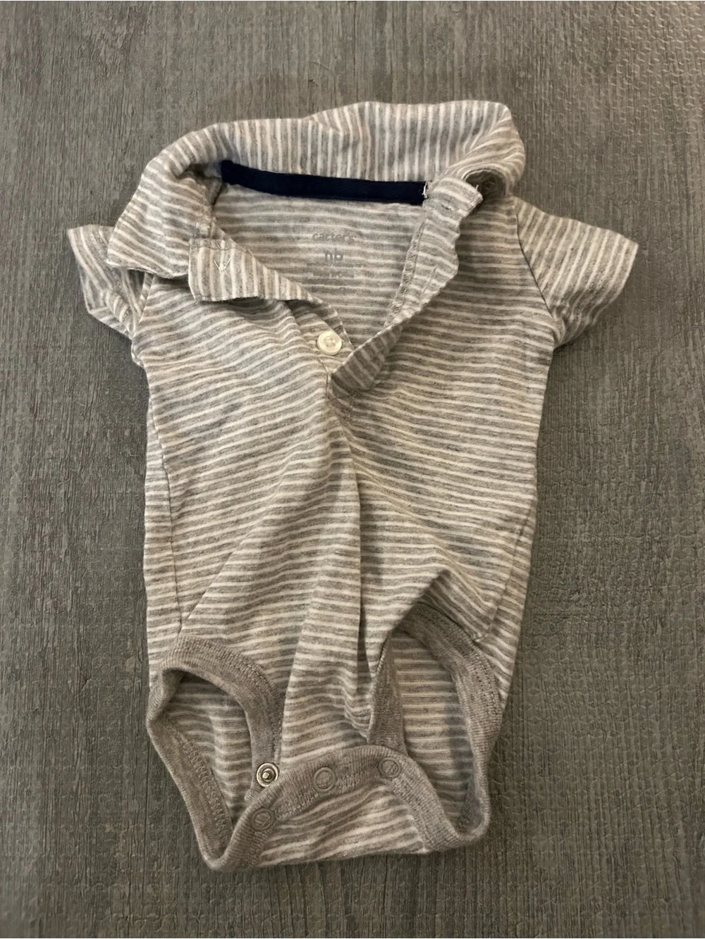 3 New born baby Carter's polo style shirts. (2 are onesies, & 1 is a shirt)